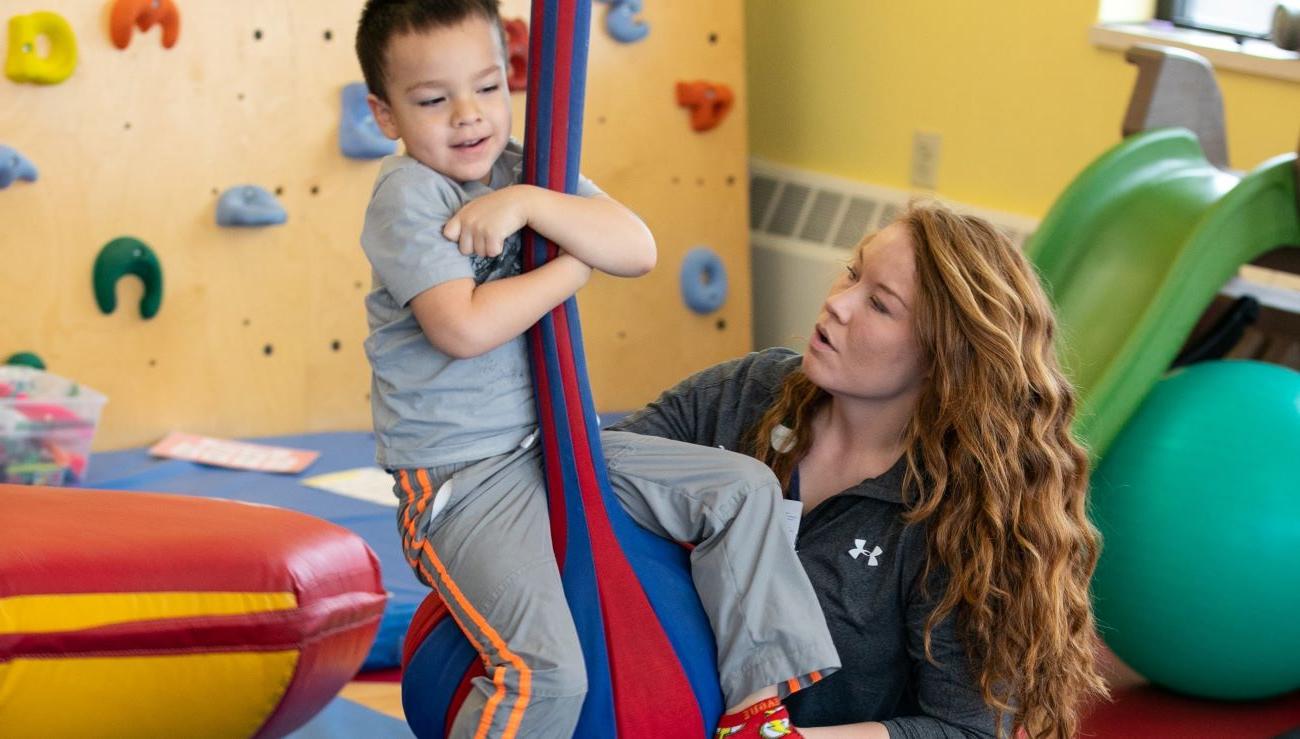 Abby Crotinger working with a child